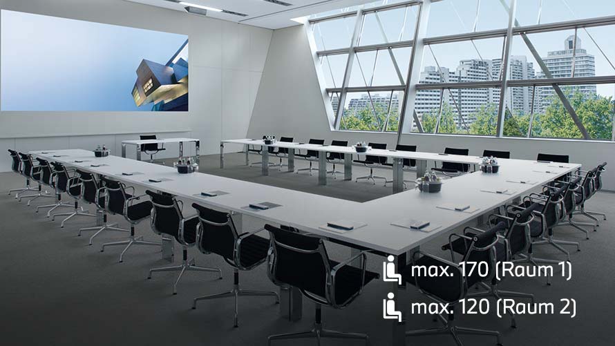 Business Center der BMW Welt München mit langem Konferenztisch und Ausblick über den Münchner Olympiapark